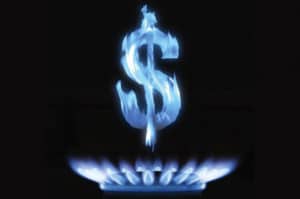 signo de dinero en flama sobre estufa prendida